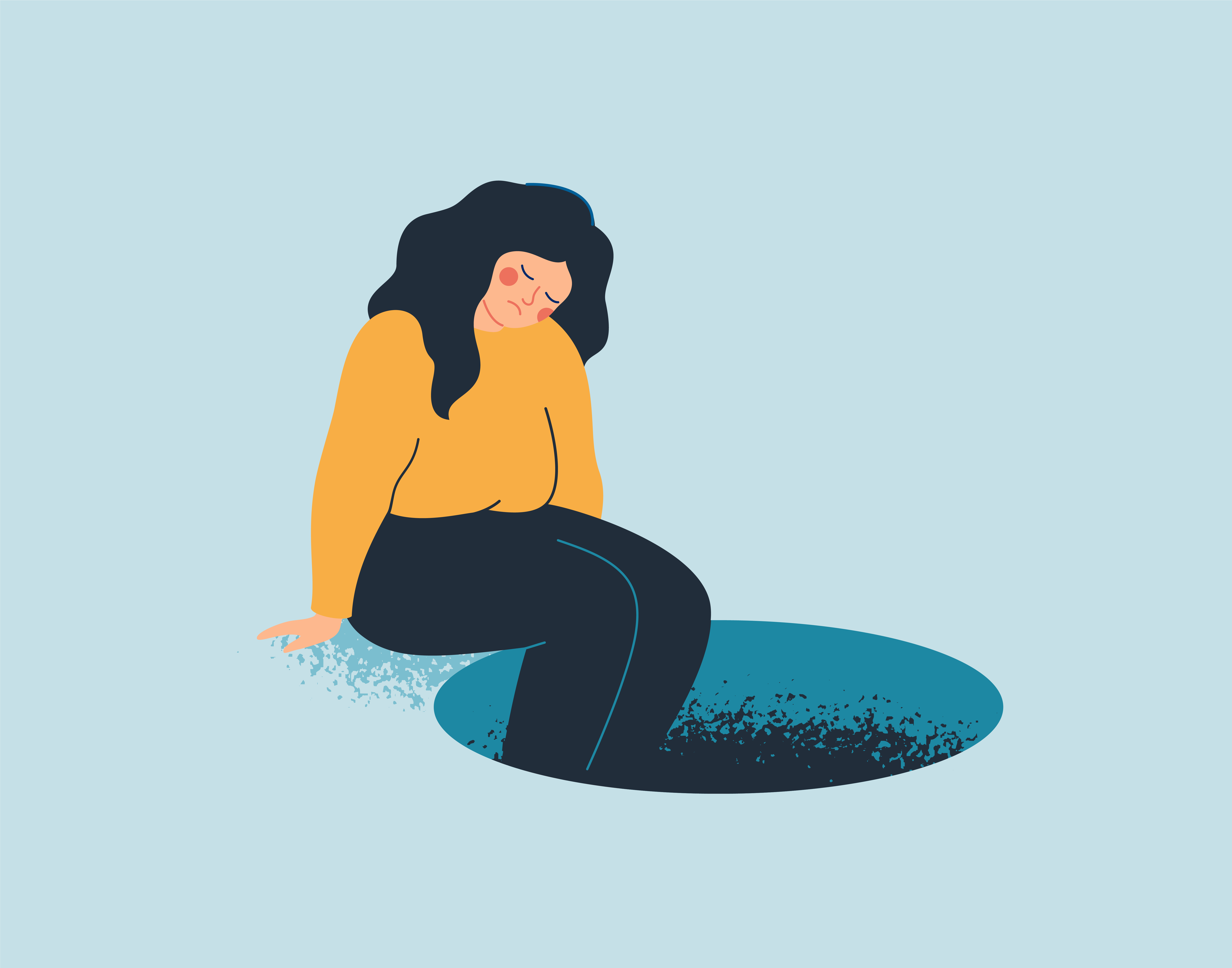 siedząca kobieta ze zmartwionym wyrazem twarzy