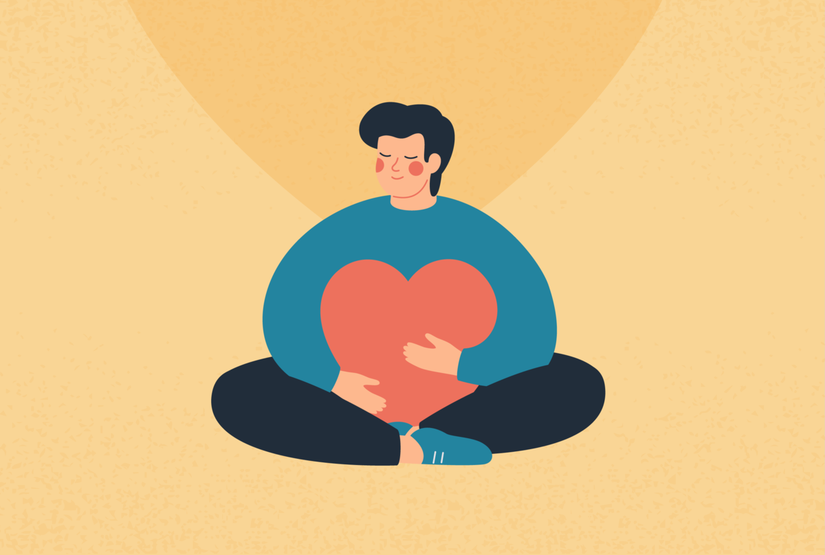 Na zdjęciu osoba, która przytula wielkie serce.