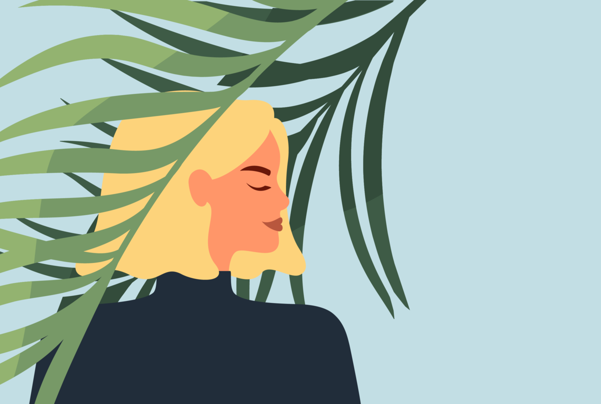 Na zdjęciu kobieta na tle drzewa.